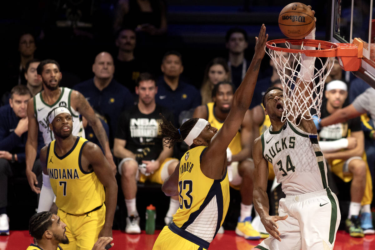 Milwaukee Bucks forward Giannis Antetokounmpo (34) shoots against Indiana Pacers center Myles T ...