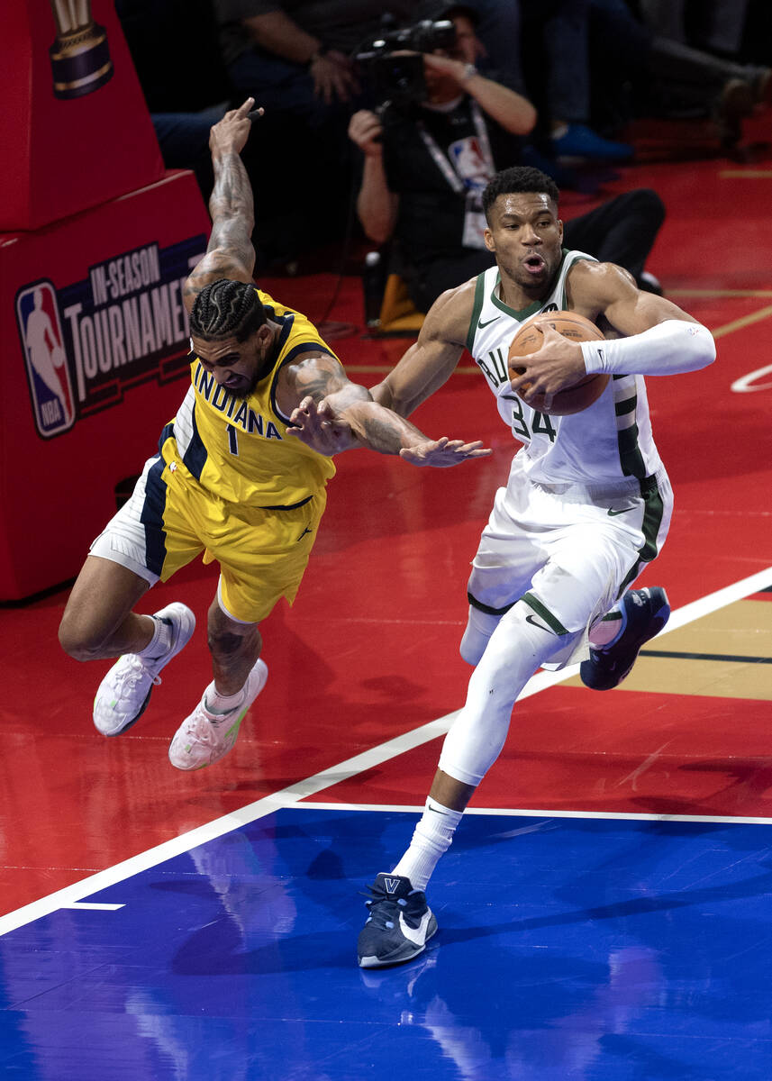 Milwaukee Bucks forward Giannis Antetokounmpo (34) works the ball against Indiana Pacers forwar ...