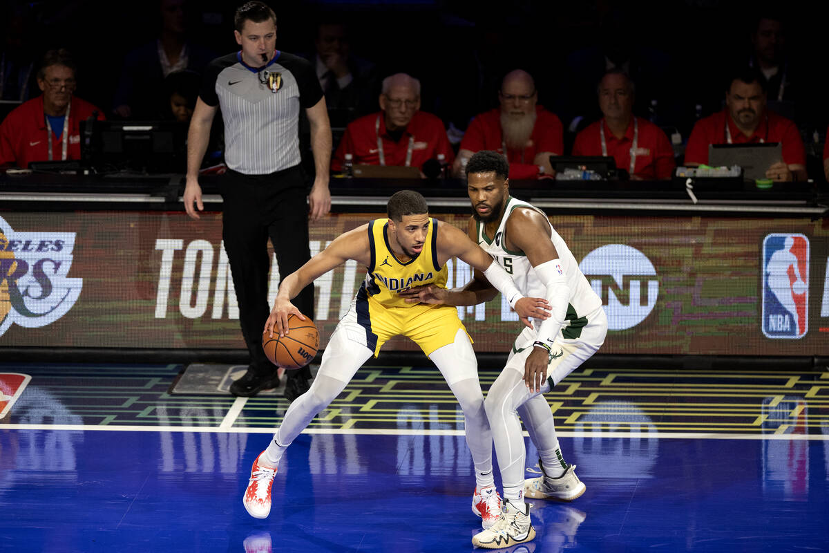 Indiana Pacers guard Tyrese Haliburton (0) dribbles against Milwaukee Bucks guard Malik Beasley ...