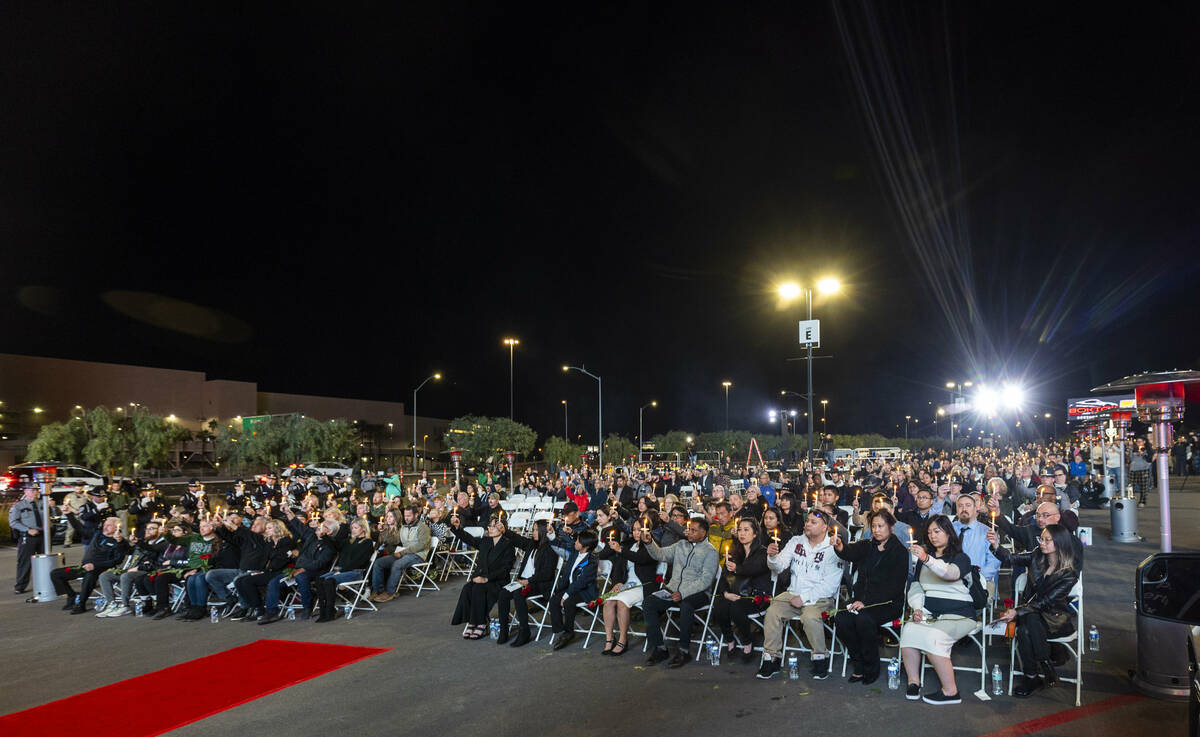 Family and supporters hold up lighted candles during a candlelight vigil for Nevada Highway Pat ...