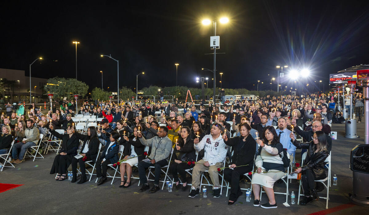 Family and supporters hold up lighted candles during a candlelight vigil for Nevada Highway Pat ...