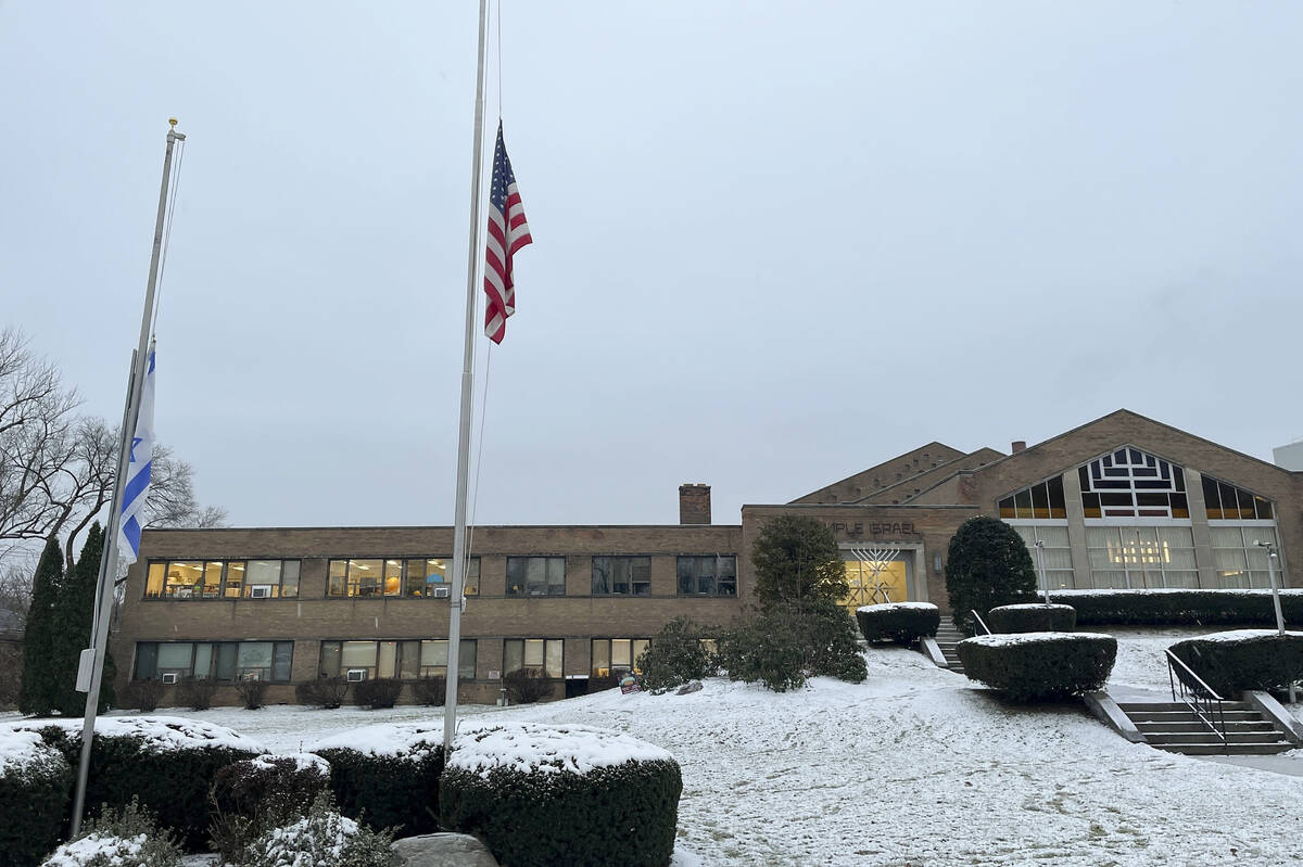 A menorah stands outside the entrance to Temple Israel, Thursday, Dec. 7, 2023, in Albany, N.Y. ...