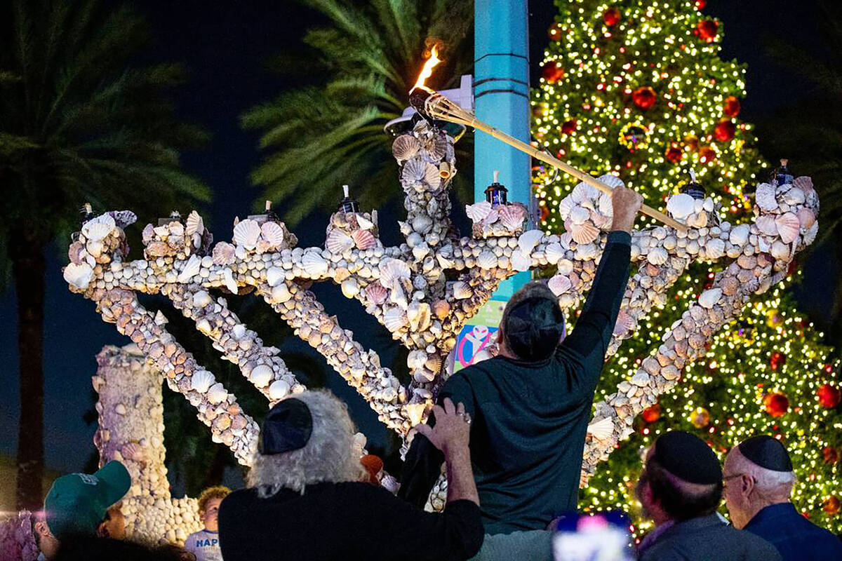 The community gathered to light artist Roger Abramson's unique seashell covered menorah in 2021 ...