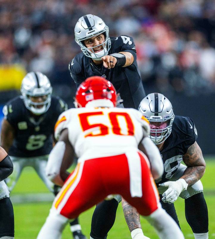 Raiders quarterback Aidan O'Connell (4) makes a call against Kansas City Chiefs linebacker Will ...