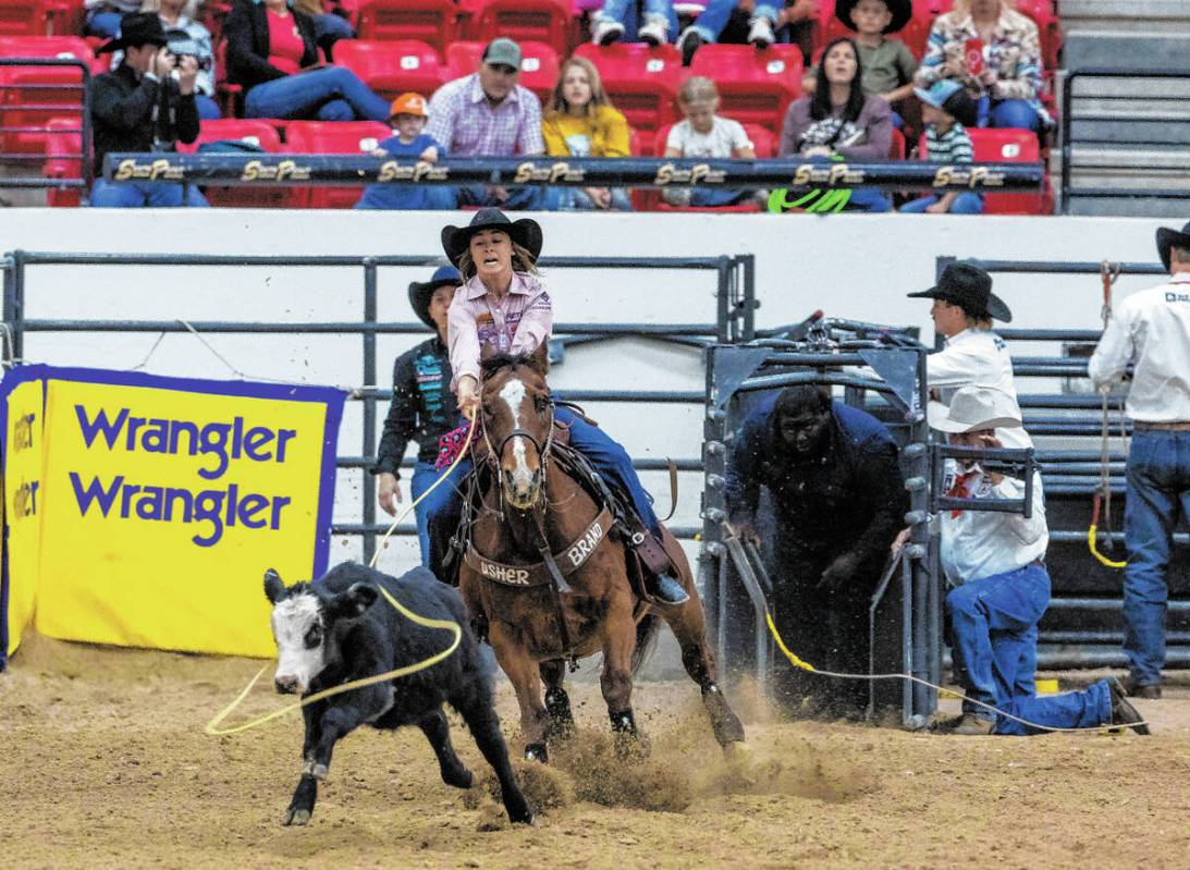 Rickie Fanning of Spearfish S.D., looks to rope a calf during the NFR breakaway roping challeng ...