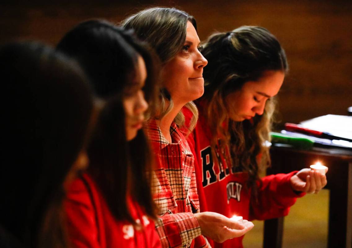 People mourn at a community prayer held for the victims of the Dec. 6 UNLV shooting, hosted at ...