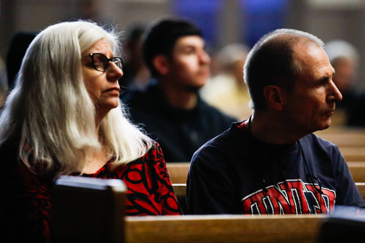 People mourn at a community prayer held for the victims of the Dec. 6 UNLV shooting, hosted at ...