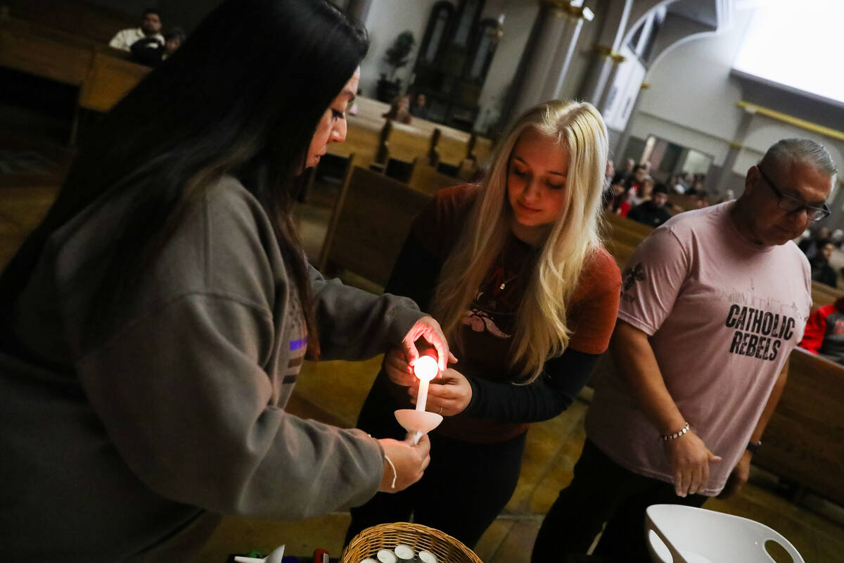 People mourn at a community prayer held for the victims of the Dec. 6 UNLV shooting, hosted at ...