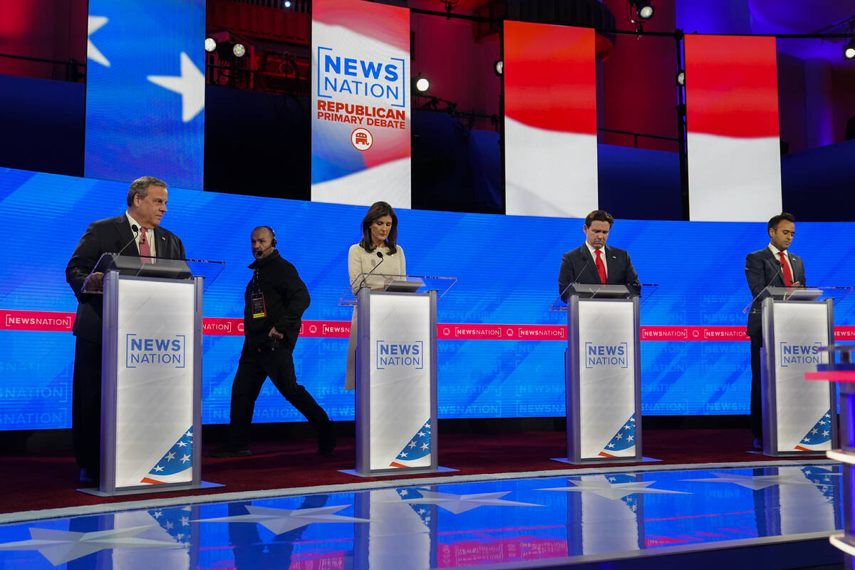 Republican presidential candidates former New Jersey Gov. Chris Christie, left, former U.N. Amb ...