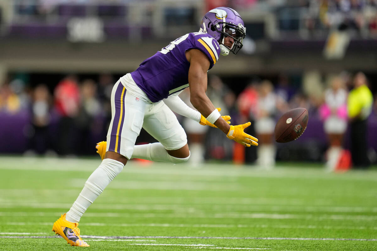 Minnesota Vikings wide receiver Justin Jefferson (18) reaches for an incomplete pass during the ...