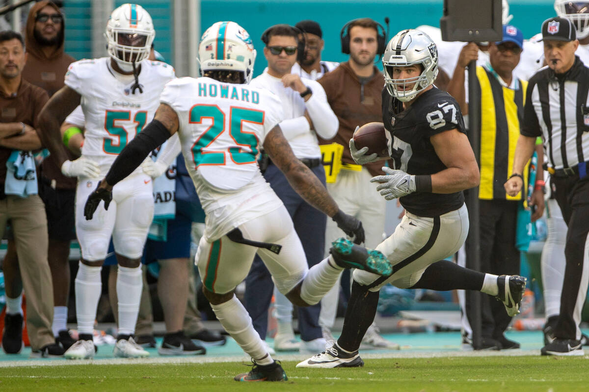 Raiders tight end Michael Mayer (87) looks for more yards against Miami Dolphins cornerback Xav ...