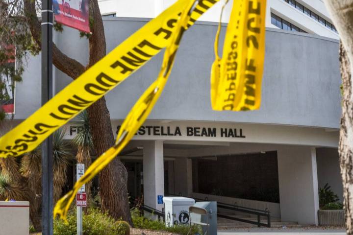 Police tape remains on a tree outside the entrance to the Frank and Estella Beam Hall following ...