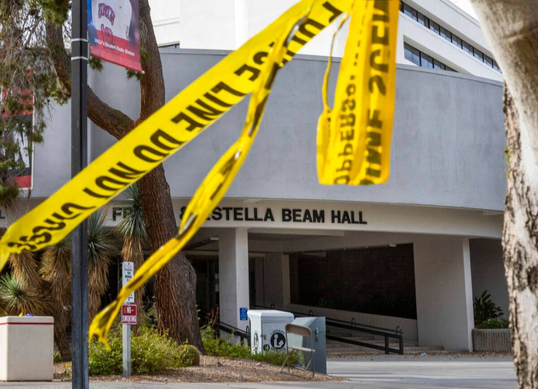 Police tape remains on a tree outside the entrance to the Frank and Estella Beam Hall following ...