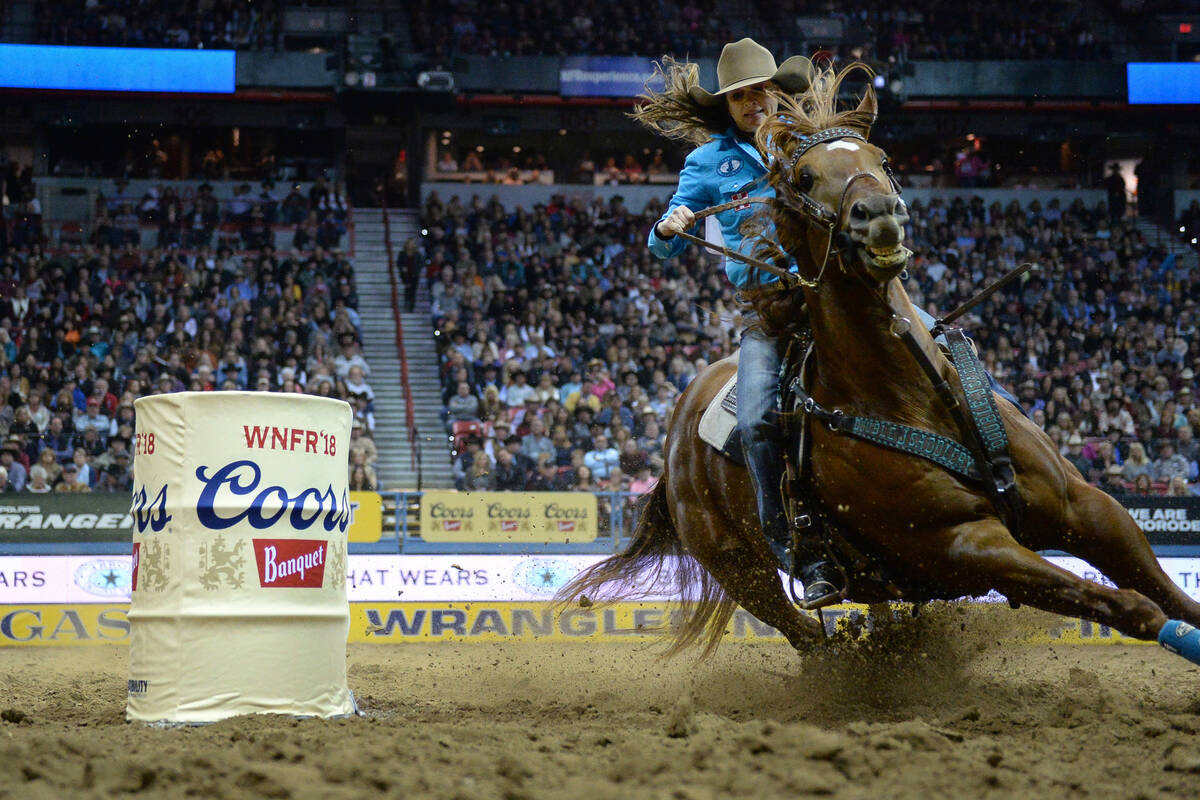 Brittany Pozzi of Tonozzi of Victoria, Texas (11) competes in Barrel Racing during the sixth go ...