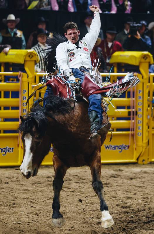 Kade Sonnier rides Irish Eyes during round one of bareback riding at NFR in the Thomas & Ma ...