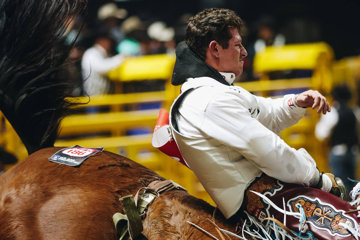 Kade Sonnier rides Irish Eyes during round one of bareback riding at NFR in the Thomas & Ma ...