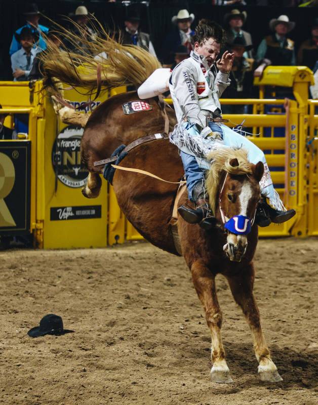 Keenan Hayes rides Lil Red Hawk during round one of bare ack riding during NFR in the Thomas &a ...