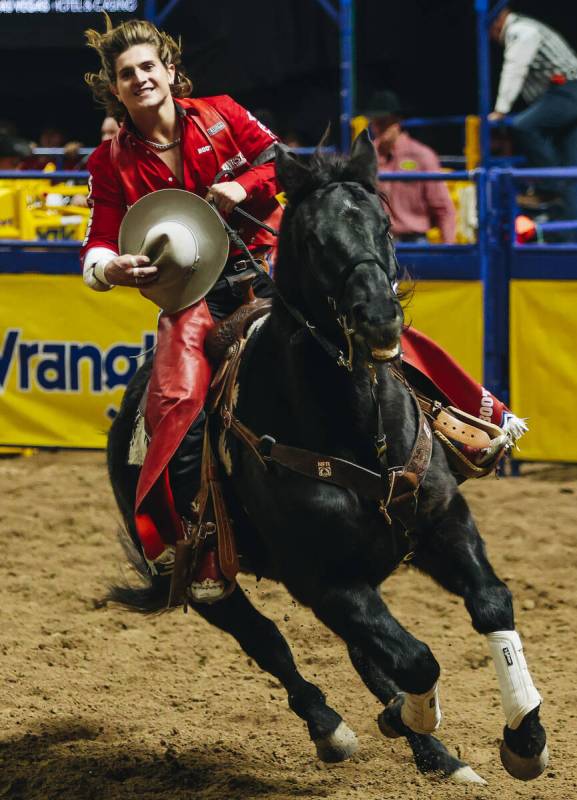 Rocker Steiner does a celebratory lap after winning round one of bareback riding with an 87 poi ...