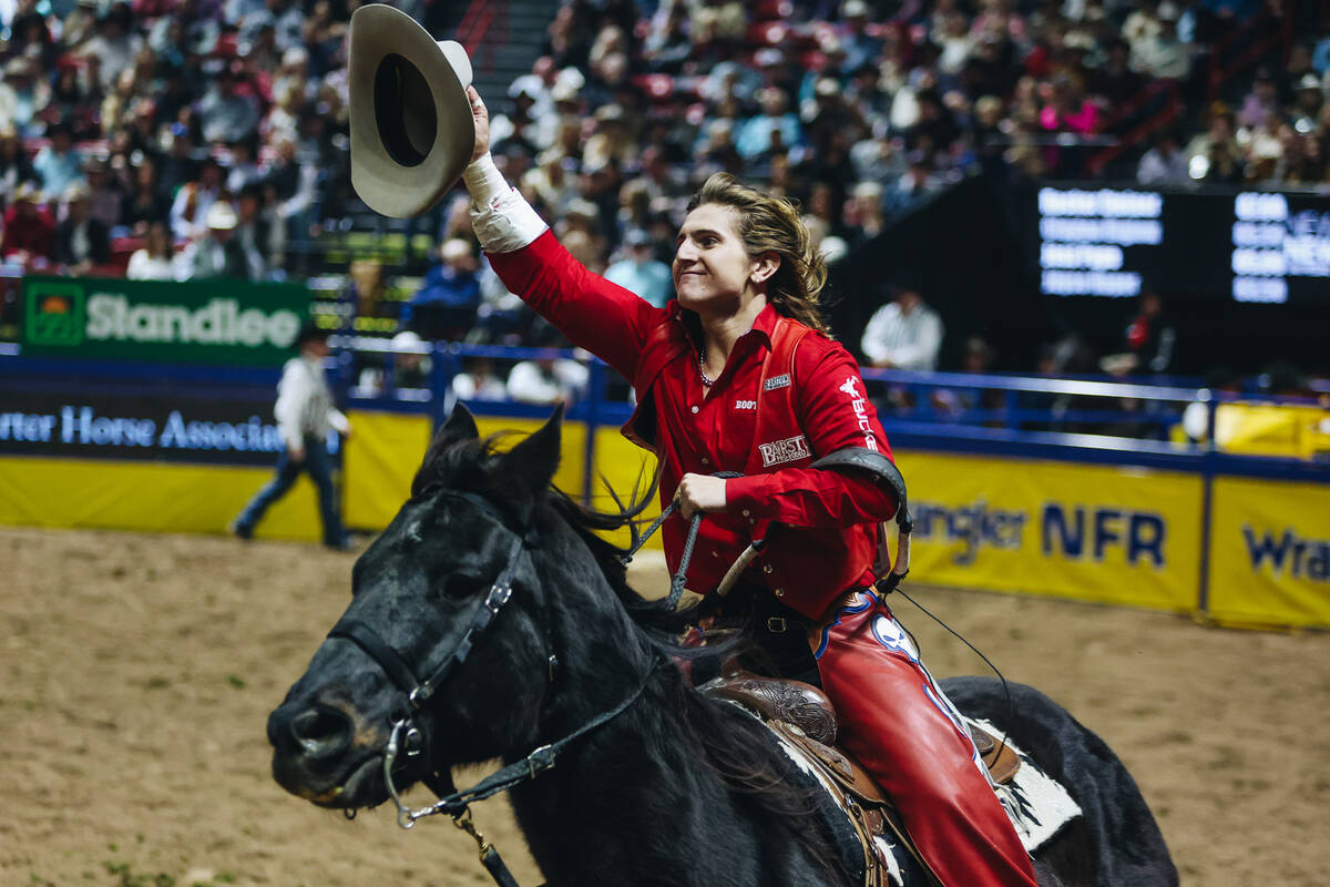 Rocker Steiner does a celebratory lap after winning round one of bareback riding with an 87 poi ...