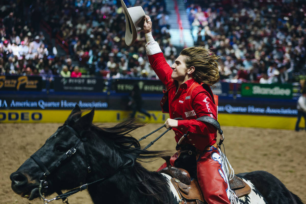 Rocker Steiner does a celebratory lap after winning round one of bareback riding with an 87 poi ...