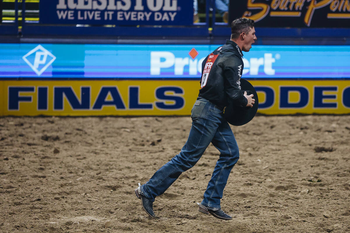 Dalton Massey celebrates his 3.5 time result and round one win during the steer wrestling porti ...