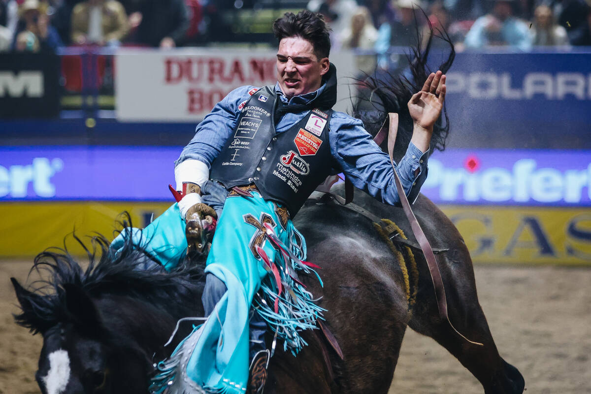 Jess Pope rides True Grit during round one of bareback riding at NFR in the Thomas & Mack C ...