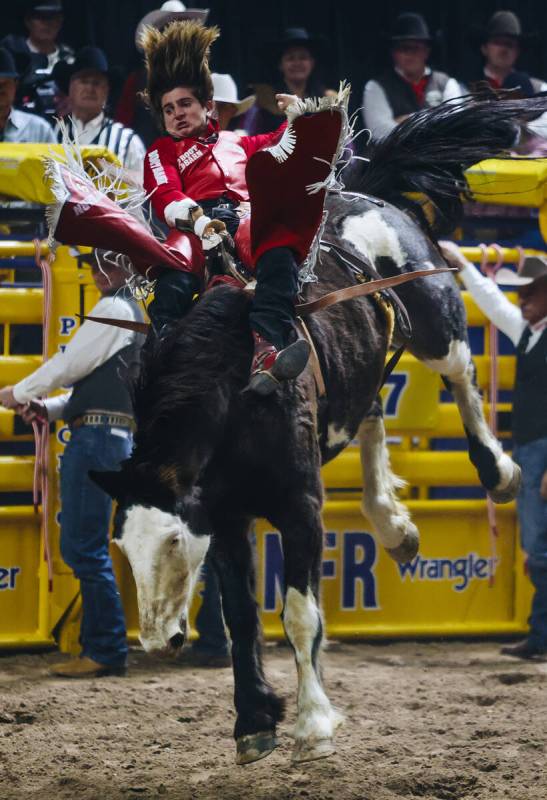 Rocker Steiner rides Risky Business during his round one bareback ride during NFR at the Thomas ...