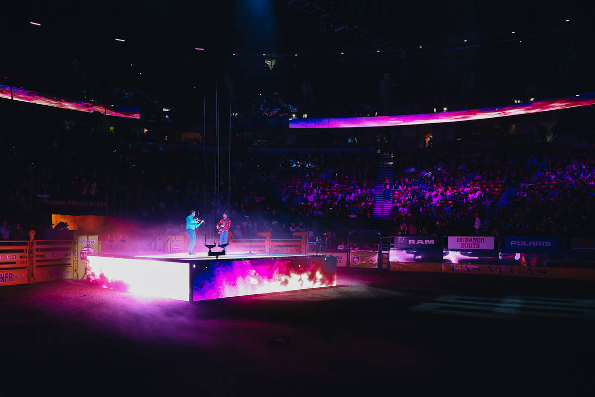 Country singer Ian Munsick performs his song “Long Live Cowgirls” during NFR at t ...