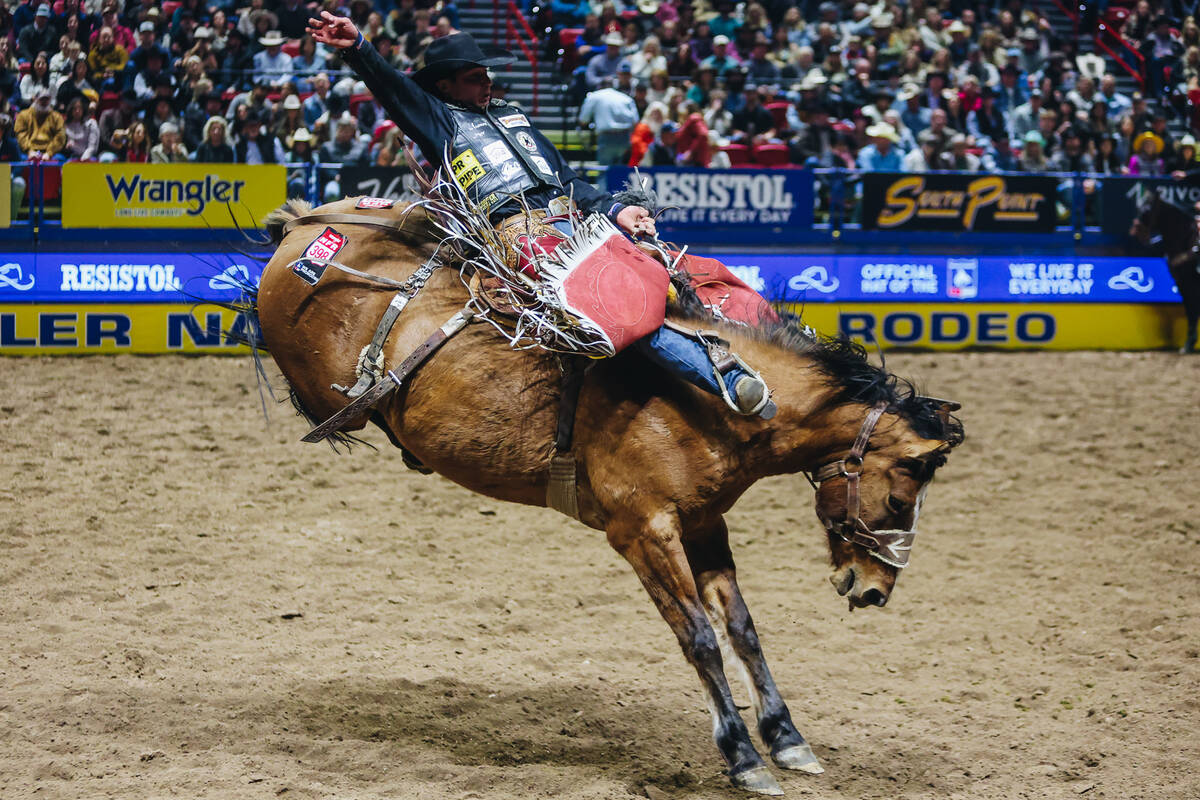 Wyatt Casper gets bucked during the saddle bronc riding portion of the National Finals Rodeo at ...