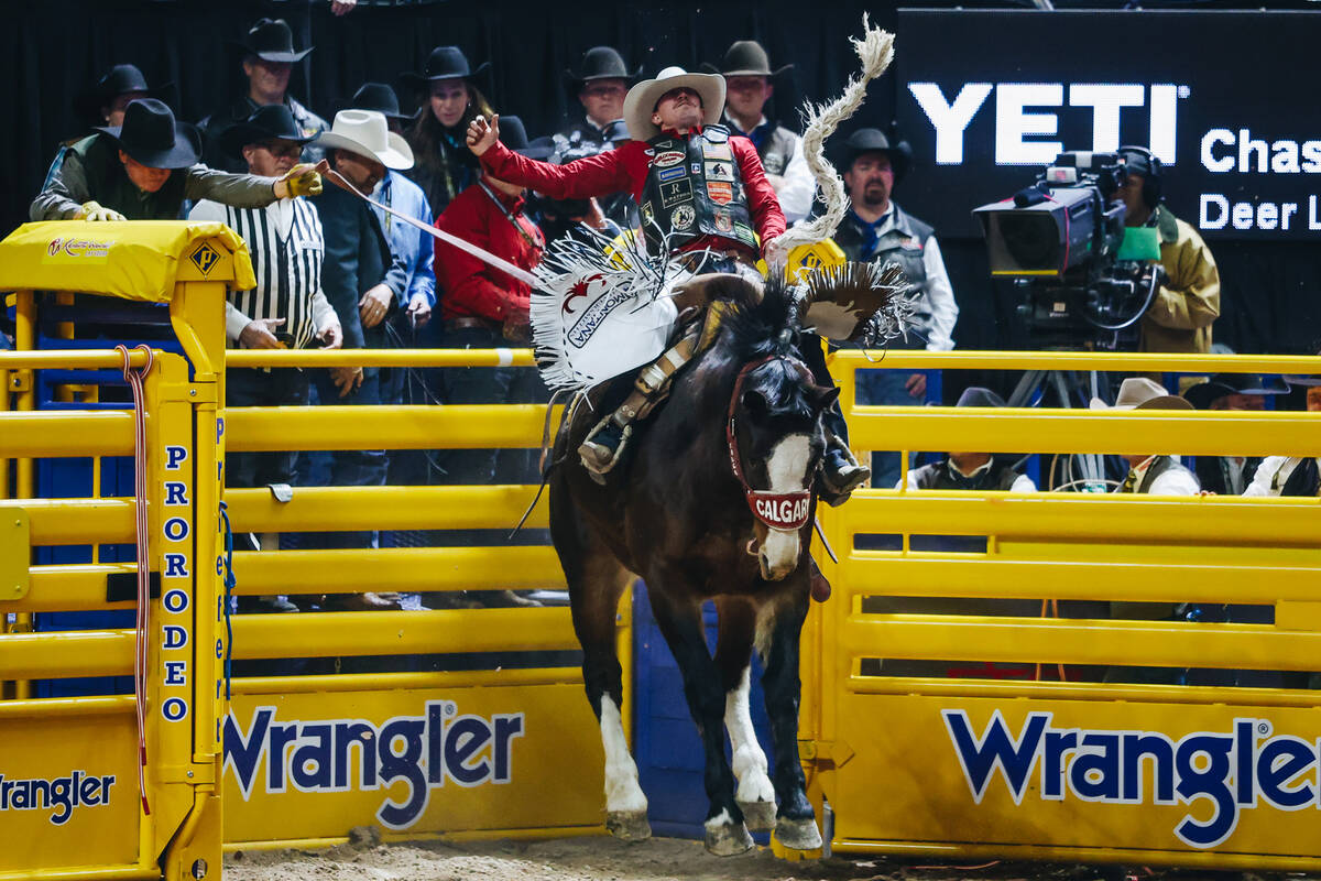 Chase Brooks bucks out of the chute on Get Down during the National Finals Rodeo at the Thomas ...