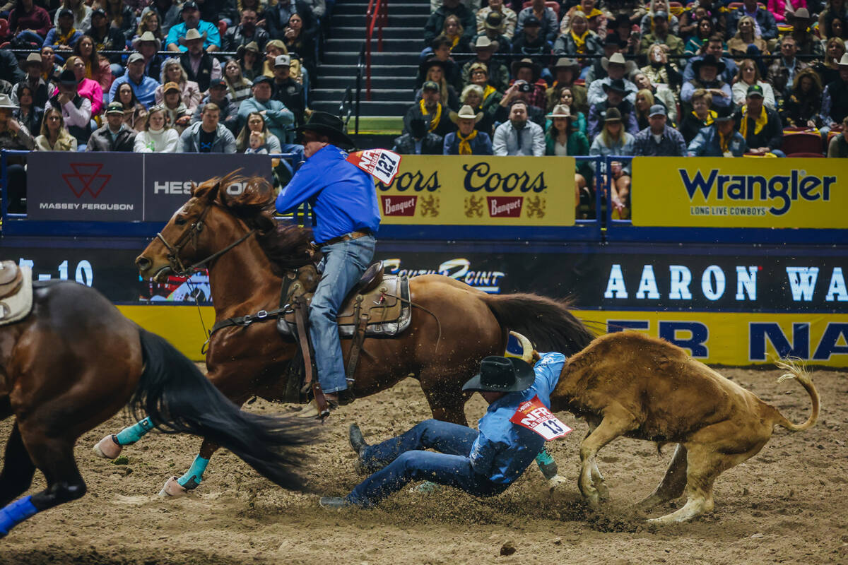 Dalton Massey slides into the dirt as he wrestles the steer during day three of the National Fi ...