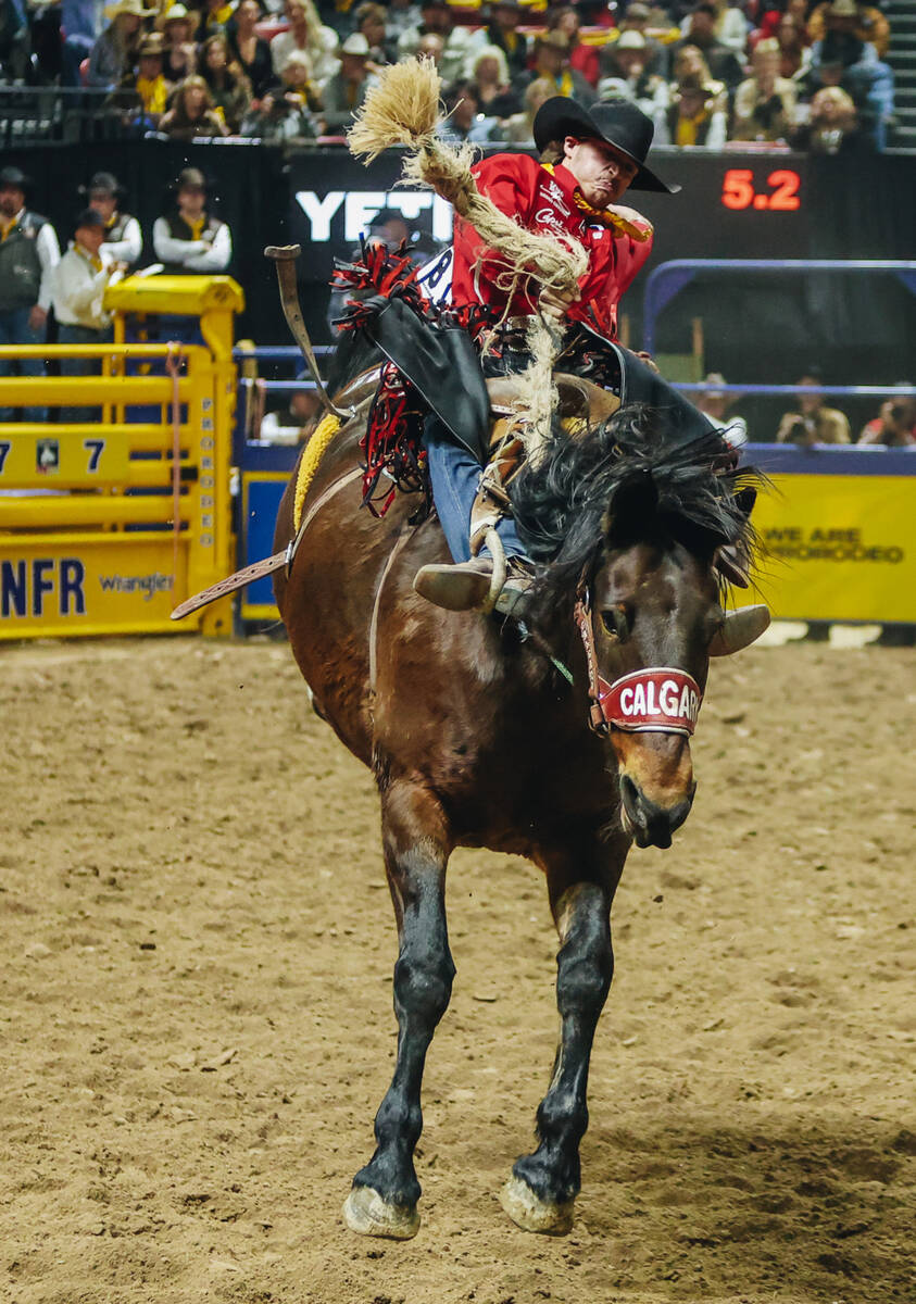 Kade Bruno gets bucked during saddle bronc riding on day three of the National Finals Rodeo at ...
