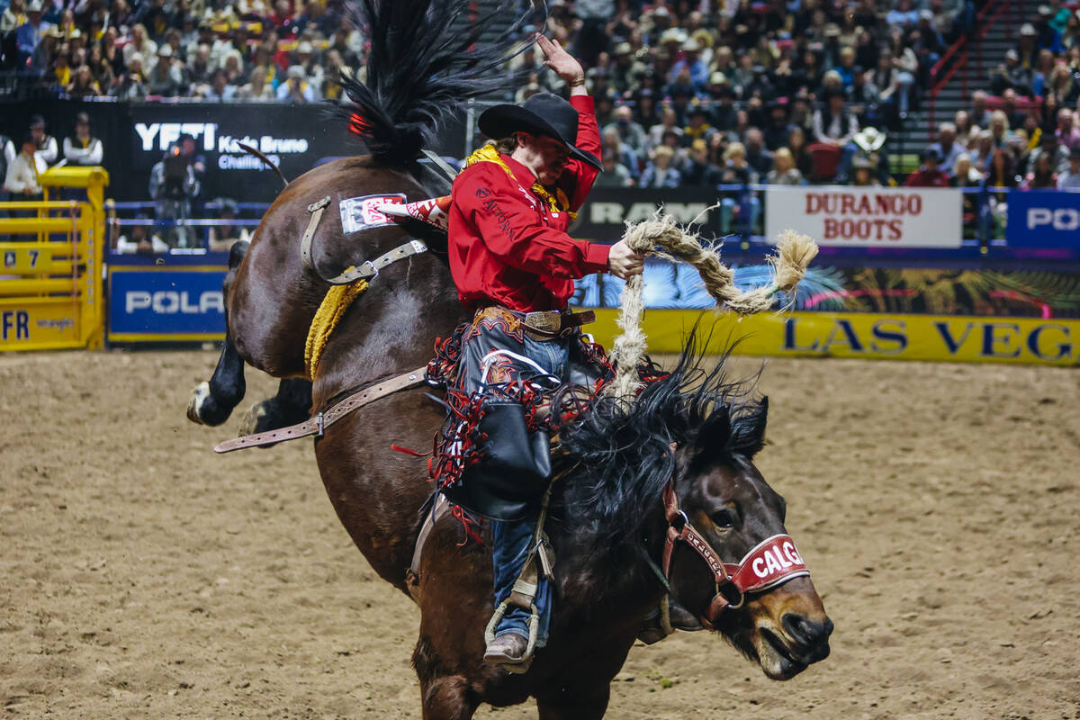 Kade Bruno gets bucked during saddle bronc riding on day three of the National Finals Rodeo at ...