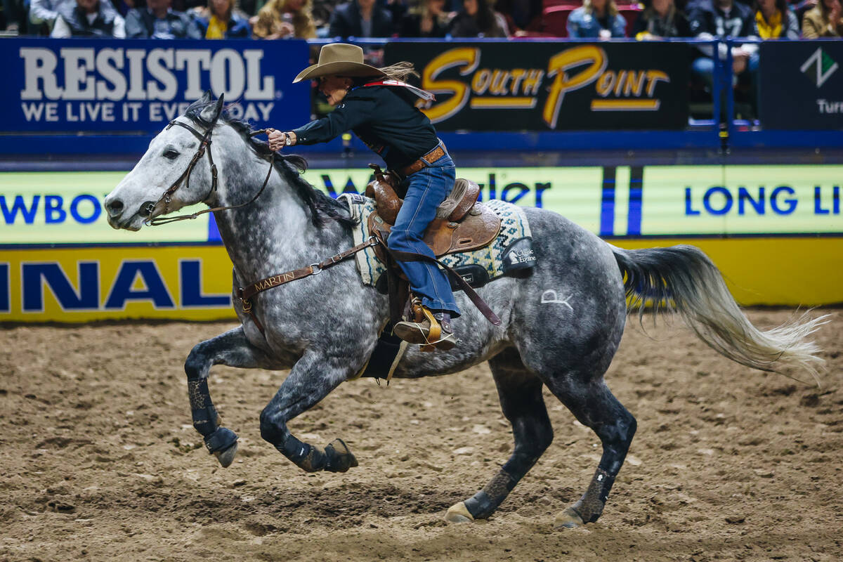 Lisa Lockhart rides her horse during barrel racing on day three of the National Finals Rodeo at ...