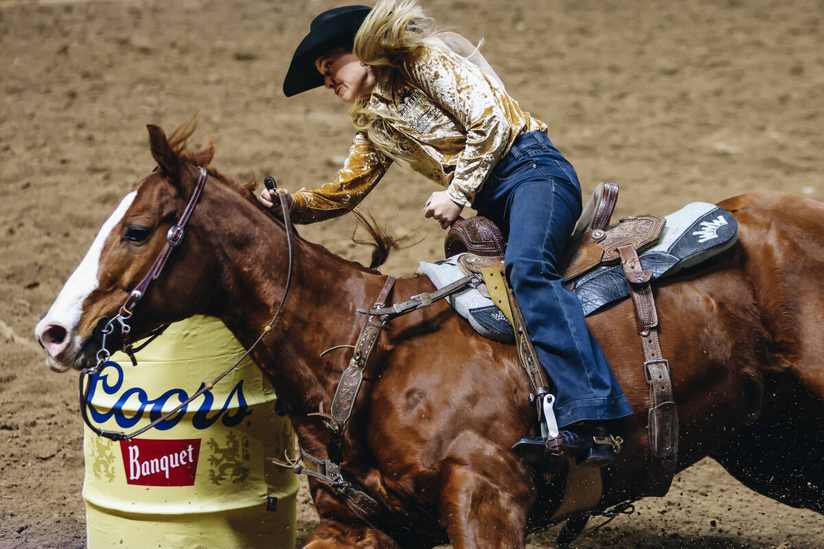 Ilyssa Smith rounds the barrel during day three of the National Finals Rodeo at the Thomas &amp ...