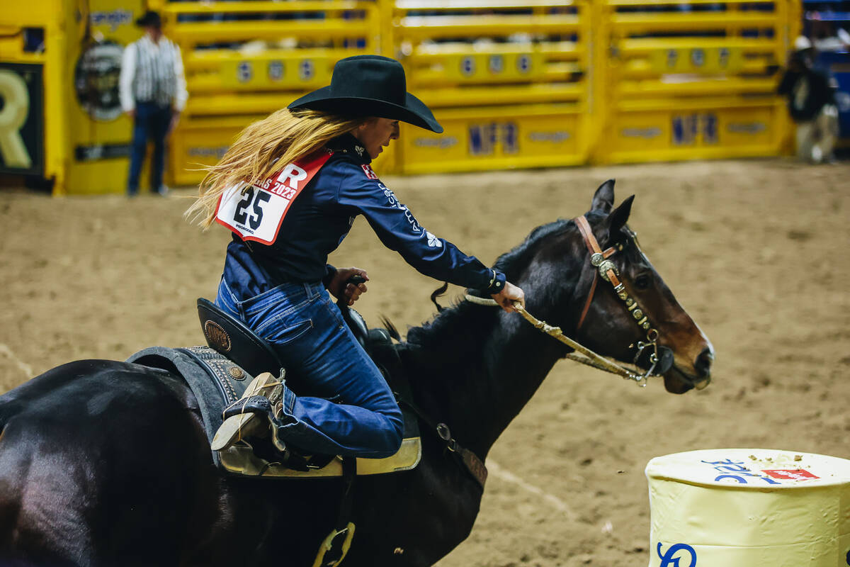Emily Beisel rounds the barrel during day three of the National Finals Rodeo at the Thomas &amp ...