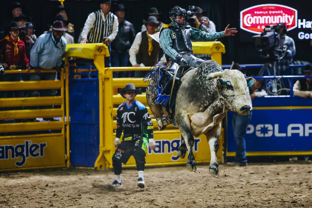 Jeff Askey rides the bull during day three of the National Finals Rodeo at the Thomas & Mac ...