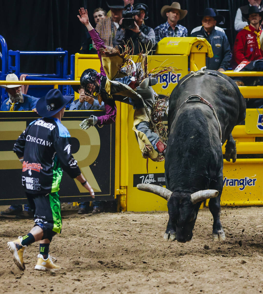 Jared Parsonage falls off of the bull during day three of the National Finals Rodeo at the Thom ...