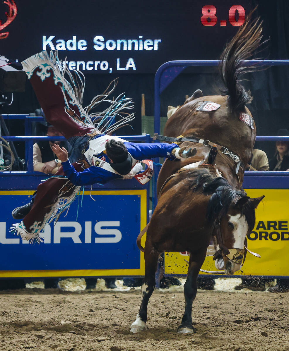 Kade Sonnier falls off the horse during day three of the National Finals Rodeo at the Thomas &a ...
