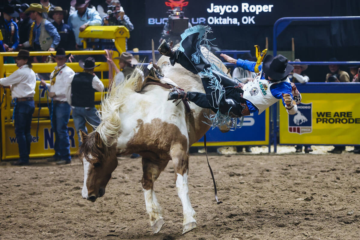 Jayco Roper gets bucked off the horse during bareback riding on day three of the National Final ...