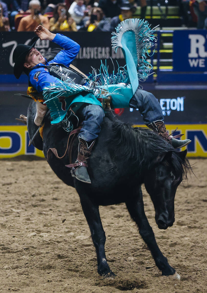 Jess Pope stays on the horse during day three of the National Finals Rodeo at the Thomas & ...