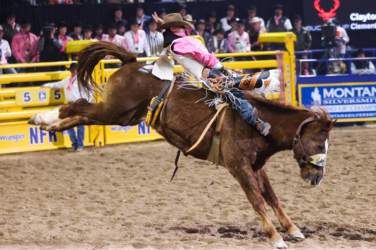 Clayton Biglow rides Pass the Hat while he competes in bareback riding on day four of the Natio ...