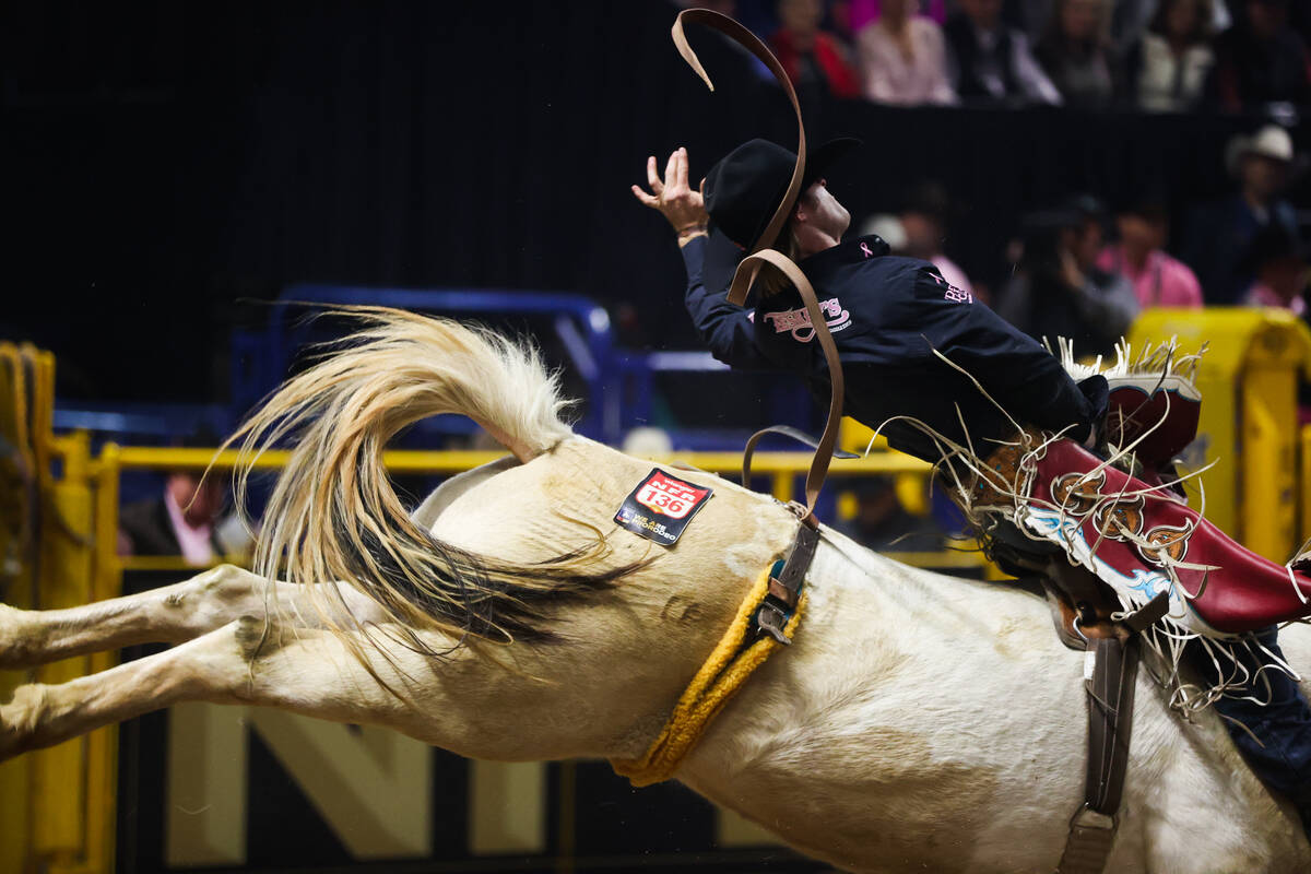 Painted Smoke bucks Leighton Berry while he competes in bareback riding on day four of the Nati ...