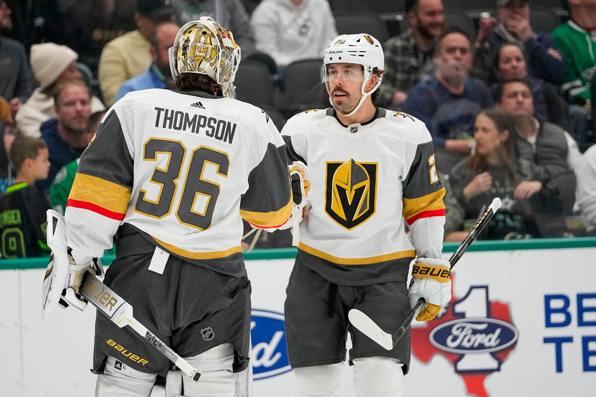 Vegas Golden Knights center Chandler Stephenson, right, celebrates his first period goal with g ...