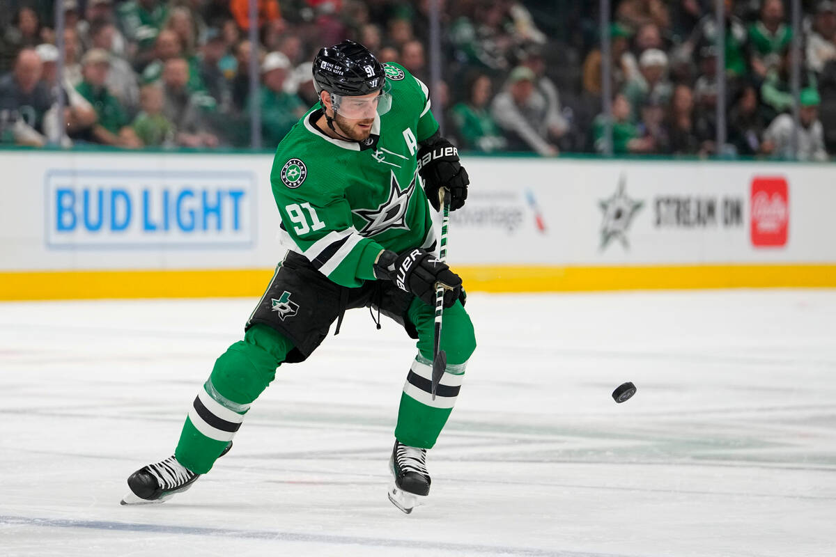 Dallas Stars center Tyler Seguin tries to control the puck against the Vegas Golden Knights dur ...