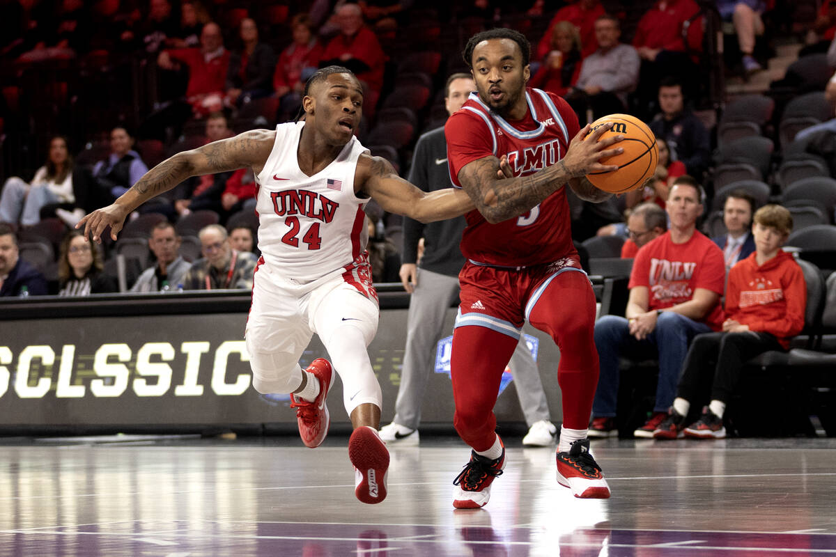 UNLV Rebels guard Jackie Johnson III (24) defends while Loyola Marymount Lions guard Justice Hi ...