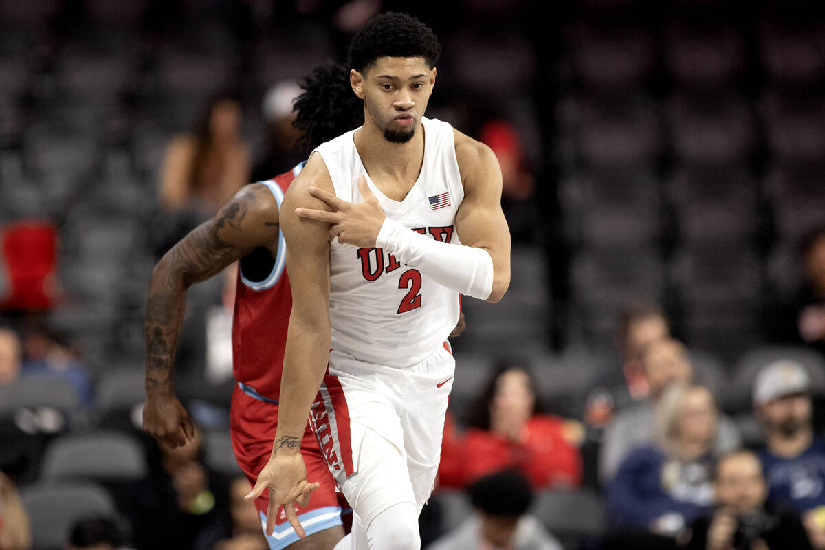 UNLV Rebels guard Justin Webster (2) celebrates after scoring a three-pointer during the first ...