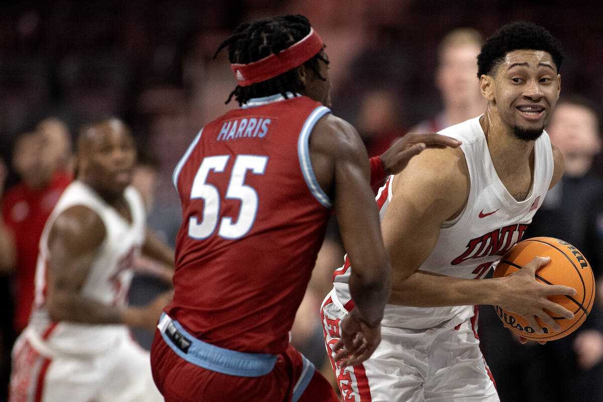 UNLV Rebels guard Justin Webster (2) looks to pass while Loyola Marymount Lions guard Dominick ...