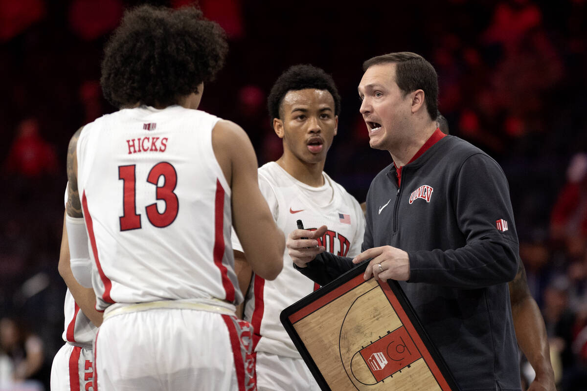 UNLV Rebels head coach Kevin Kruger speaks to his team in a timeout during the second half of a ...