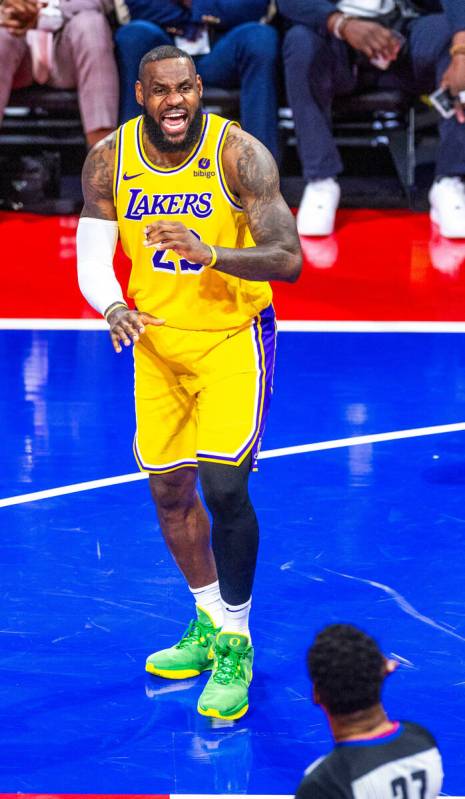 Los Angeles Lakers forward LeBron James (23) is unhappy about a foul call while facing the Indi ...